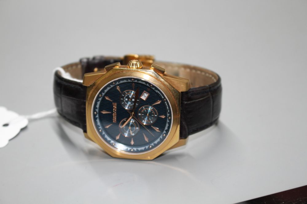 A gentlemans gilt steel Robert Cavalli quartz chronograph wrist watch, with box.